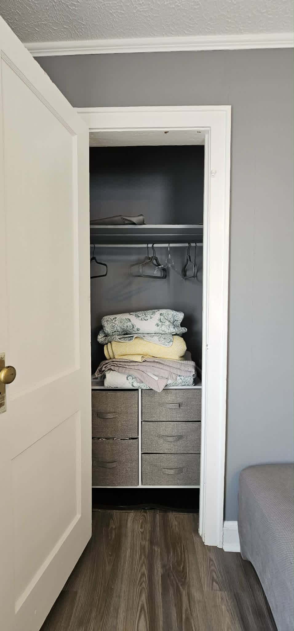 Closet with extra linens and hangers